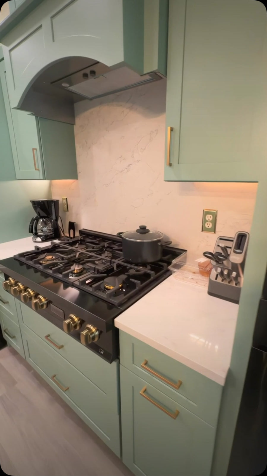 Green Shaker kitchen with gold hardware